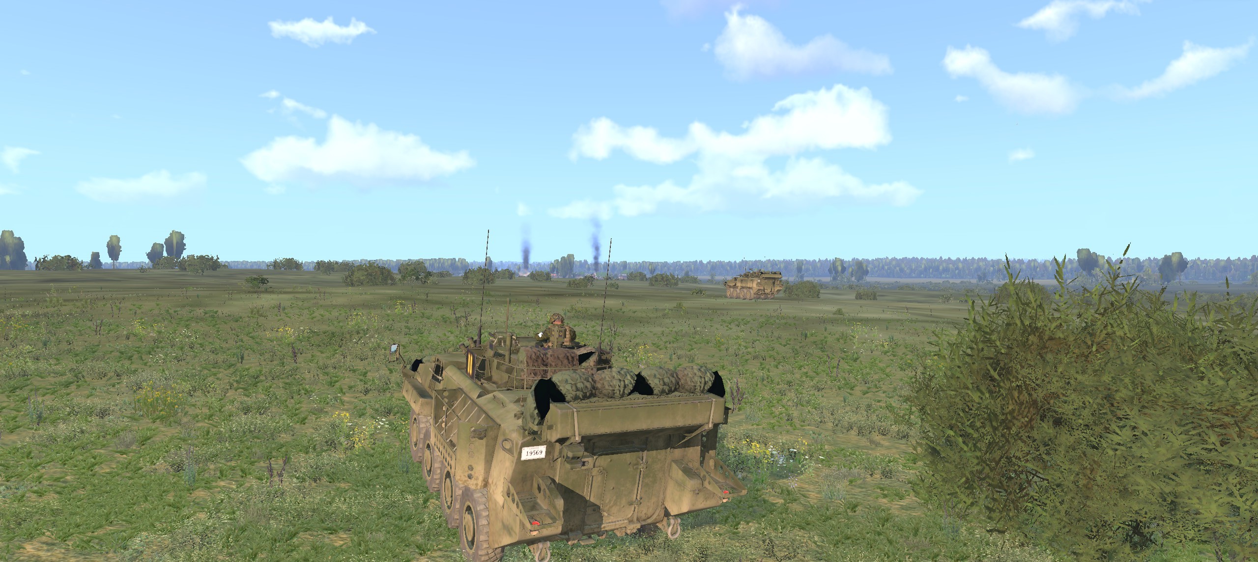 Canadian LAVs roll past more burning vehicles around OBJ TAHOE and OBJ IMPALA destroyed by friendly armour. (Virtual Arma)