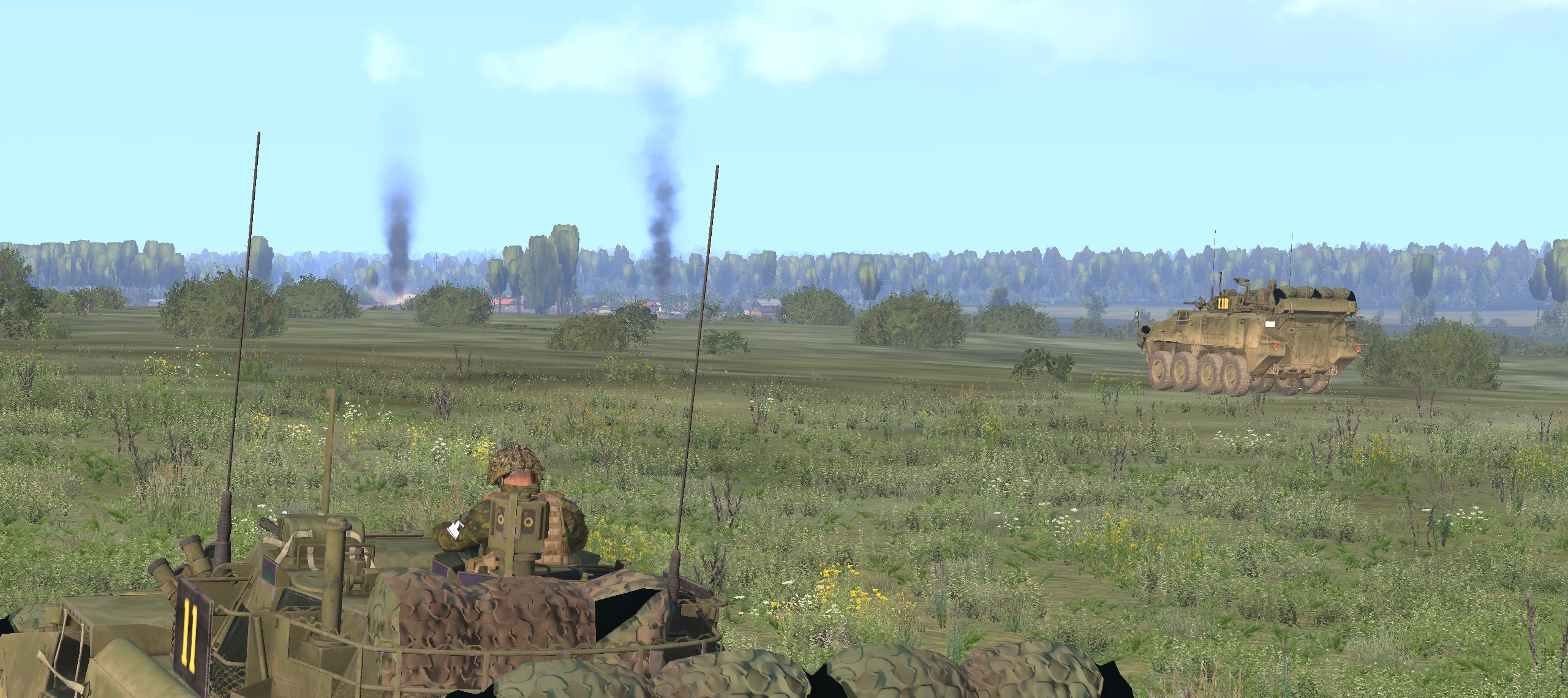 Combat team driving past a burning vehicle inside OBJ IMPALA (Virtual Arma)